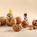 closeup shot of miniature labor figures on walnuts 2023 11 27 05 28 44 utc