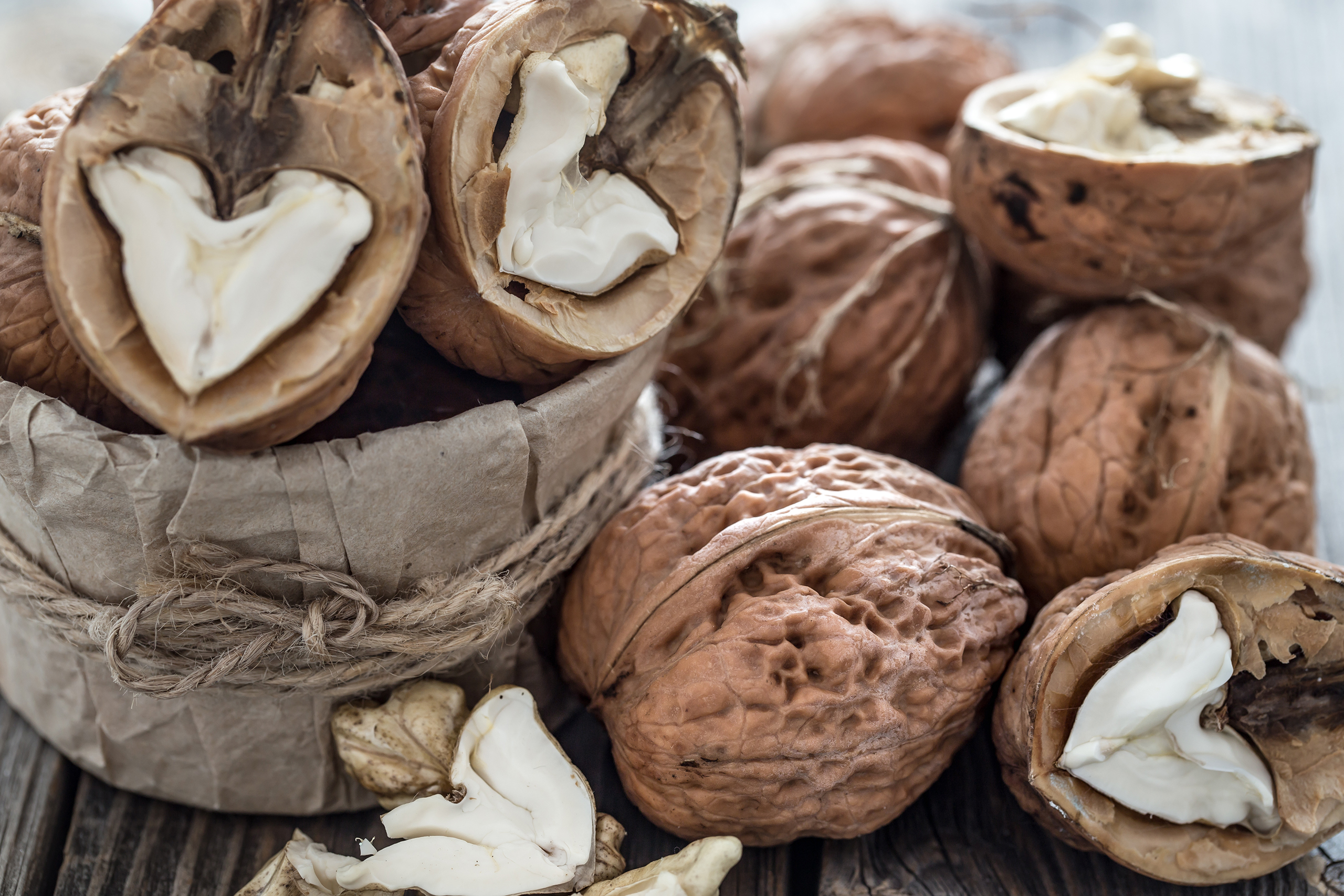 walnut in open form on a wooden background close 2023 11 27 05 05 32 utc